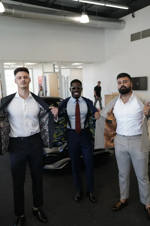 Clients revealing the custom patterned linings inside their suit jackets
