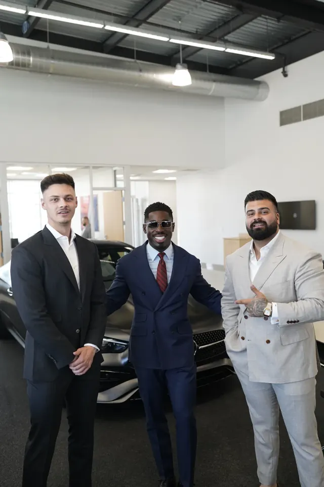 Three Summit Customs clients in navy, charcoal and grey custom suits